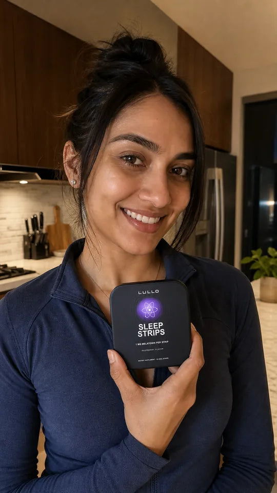 Woman holding a Lullo Sleep Strips tin during her evening routine
